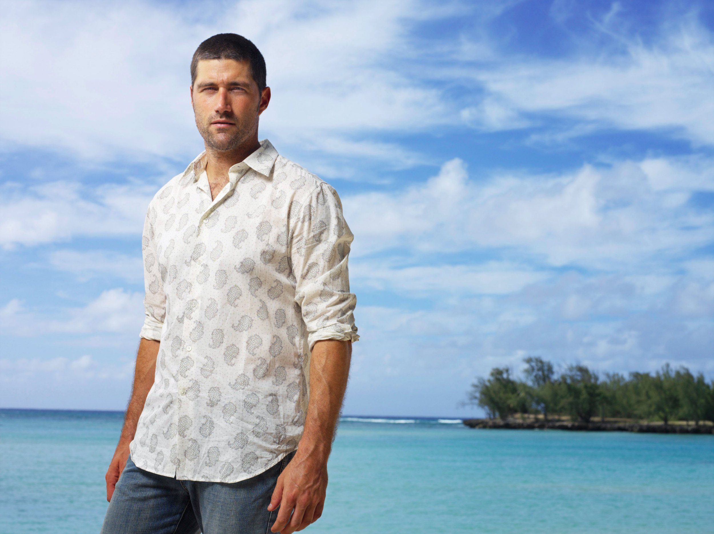Matthew Fox as Jack Shephard in Lost standing against an ocean background