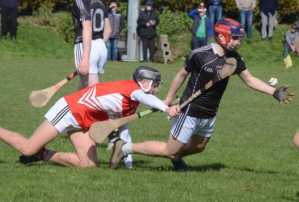 George Feeney of St Francis College Rochestown manages to handpass the sliothar despite being brought to the ground by Eoghan Fraser of Midleton CBS during the Cork Post Primary U16 A Hurling final which was played in Cobh. Picture: Howard Crowdy George Feeney of St Francis College Rochestown manages to handpass the sliothar despite being brought to the ground by Eoghan Fraser of Midleton CBS during the Cork Post Primary U16 A Hurling final which was played in Cobh. Picture: Howard Crowdy