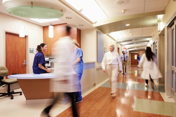 Blurry image of doctors and health staff in modern hospital