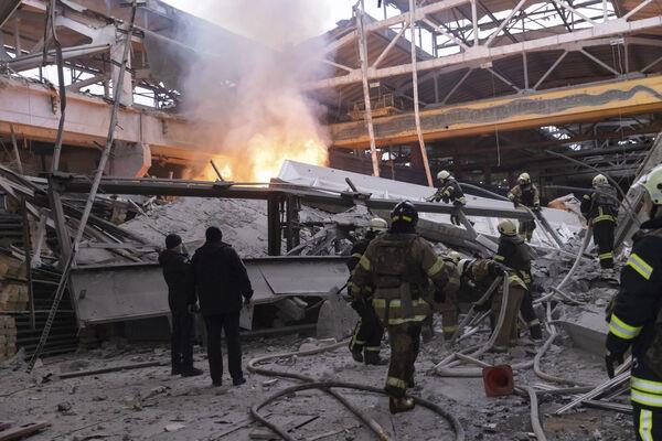 Firefighters work to extinguish a fire after a Russian attack in Kharkiv, Ukraine, Friday, Dec. 29, 2023. (AP Photo/Yevhen Titov) Firefighters work to extinguish a fire after a Russian attack in Kharkiv, Ukraine, Friday, Dec. 29, 2023. (AP Photo/Yevhen Titov)