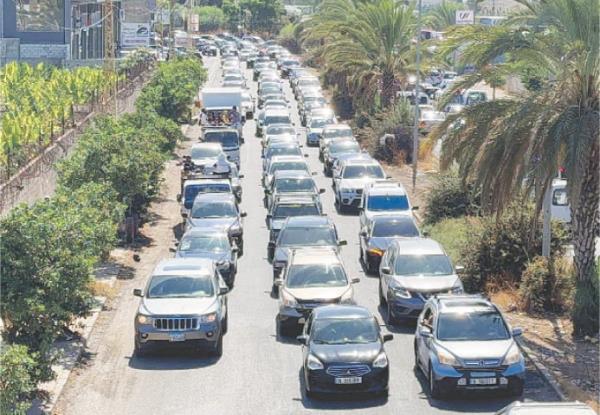  Cars go north from Lebanon’s coastal city of Sidon as some Lebanese flee heavy Israeli bombardment, on Monday.—Reuters 