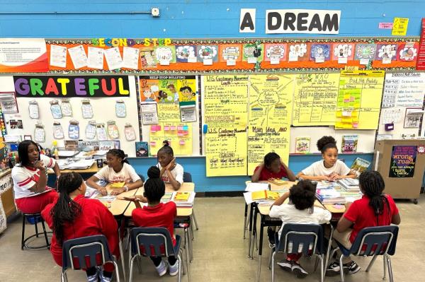 Elementary school teacher Charlotte Owens working with her fifth grade students during literature class in a Chicago Public School.