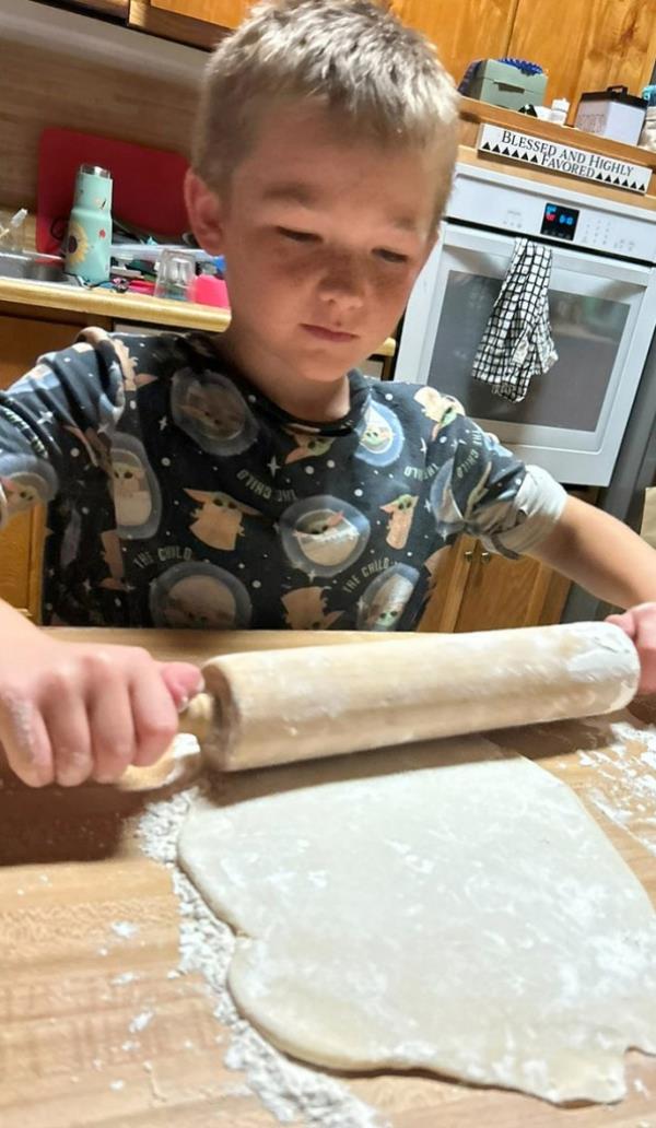 Allen Gage rolling out pie crust