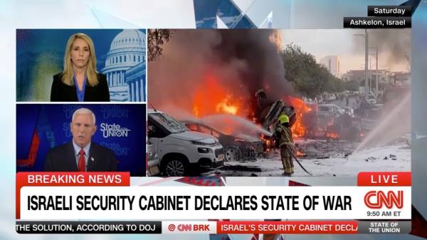 Pence is pictured speaking with Dana Bash as images appear of the violence in Israel.