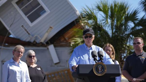 Biden tours Florida's storm-hit streets as Milton debris piles up