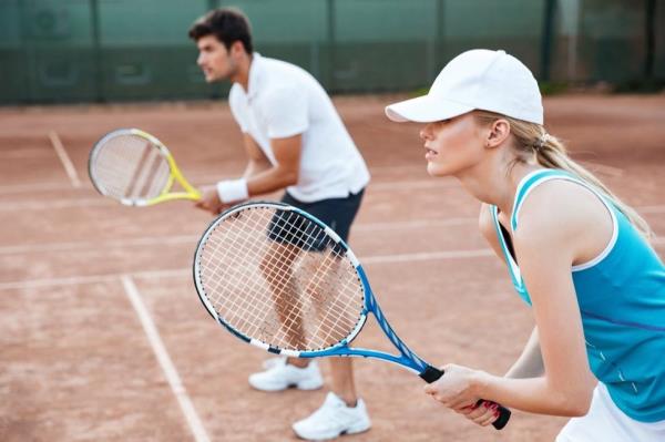 A couple playing tennis