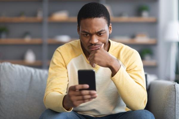 man on phone looking upset