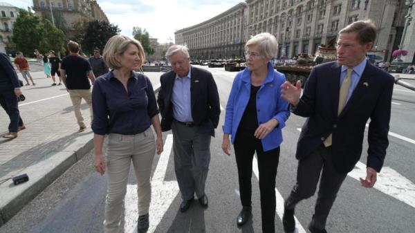 Holly Williams in Ukraine along with Sen. Lindsey Graham, Sen. Elizabeth Warren and Sen. Richard Blumenthal. / Credit: 60 Minutes