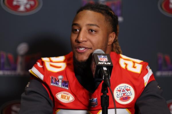 Justin Reid of the Kansas City Chiefs in a football jersey speaking to the media during Super Bowl LVIII media availability.