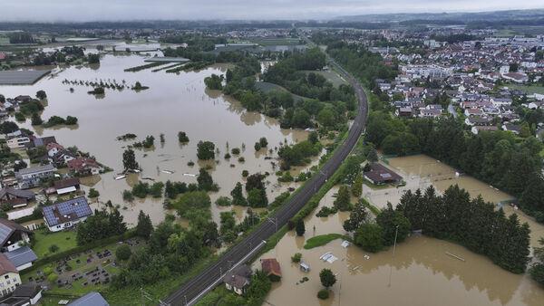 Firefighter dies and train derails amid heavy rain and flooding in Germany