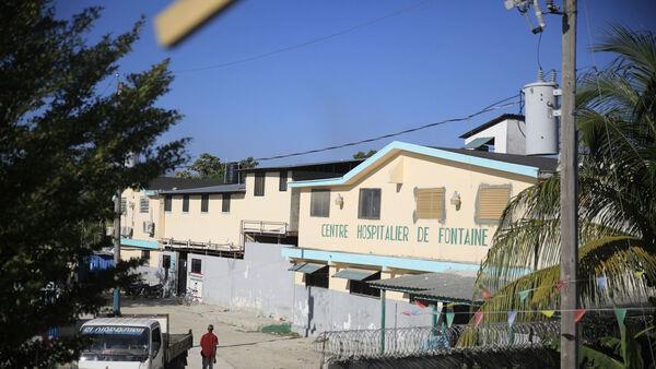 Hospital director in Haiti says gang stormed in and took hundreds hostage