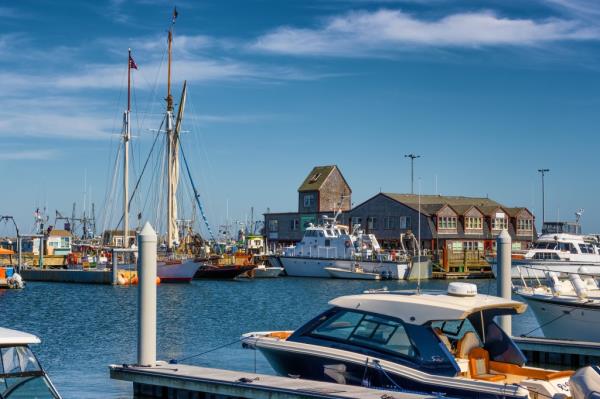 Assortment of boats of various sizes docked in the harbor of Providence town, Massachusetts on September 14, 2022