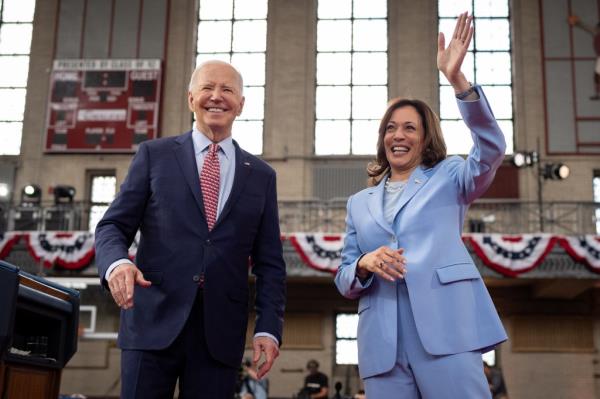 President Joe Biden and Vice President Kamala Harris waving to the audience at a campaign rally in Philadelphia