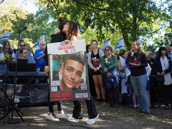 The mother of hostage Edan Alexander (right) joined a large demonstration in Central Park on Sunday