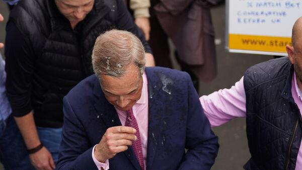 Woman arrested after Nigel Farage doused with milkshake outside pub