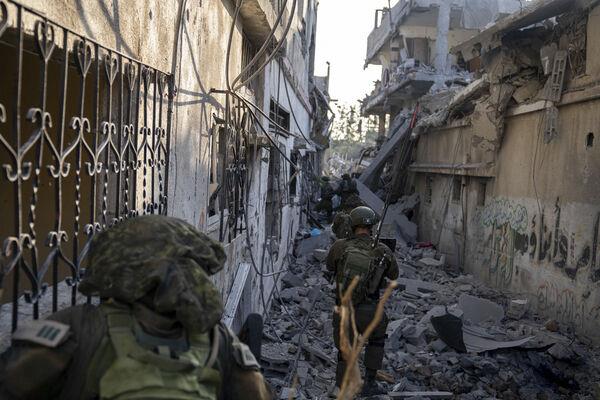 Israeli troops are seen during a ground operation in the Gaza Strip. Israeli ground forces have been operating in Gaza in recent days as Israel presses ahead with its war against Hamas militants. (Picture: Israel Defense Forces via AP) Israeli troops are seen during a ground operation in the Gaza Strip. Israeli ground forces have been operating in Gaza in recent days as Israel presses ahead with its war against Hamas militants. (Picture: Israel Defense Forces via AP)