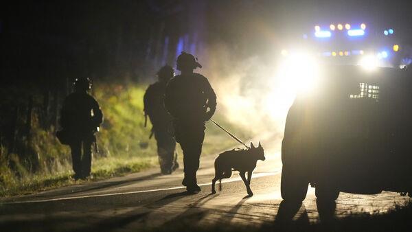 Heavily armed police surround home in search for Maine shooting suspect