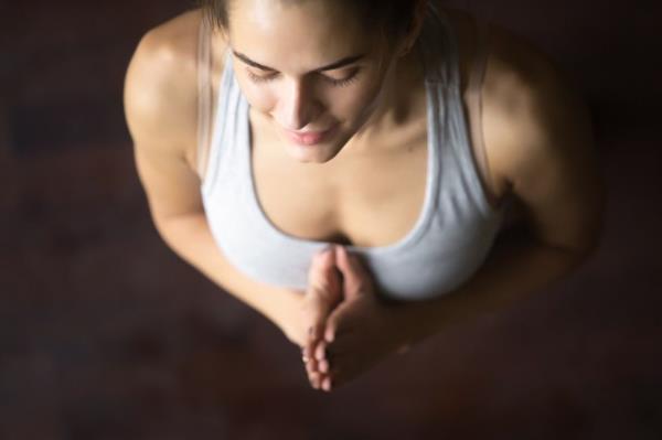 A woman meditates before bed