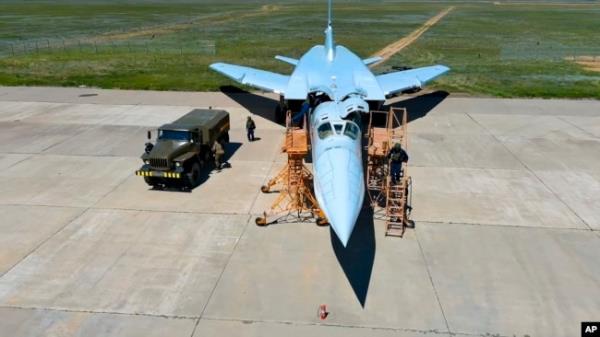 FILE - A crew prepares a Tu-22M3 bomber as part of drills to train for using tactical nuclear weapons, at an undisclosed location in Russia, in this photo released May 21, 2024. (Russian Defense Ministry Press Service/AP)