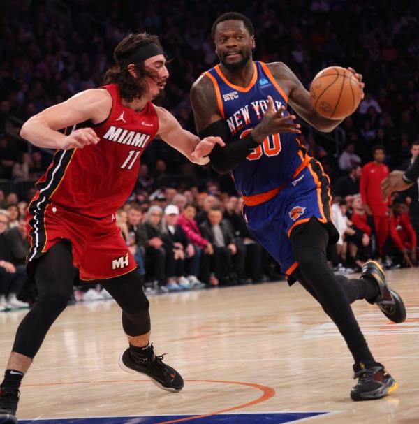 Knicks forward Julius Randle (30) drives to the basket as Miami Heat guard Jaime Jaquez Jr. (11) defends during a game on Jan. 27, 2024 at Madison Square Garden in New York.  