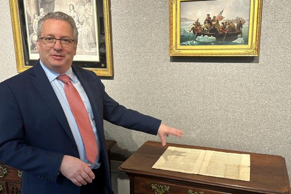 Historian Seth Kaller shows off a 1787 copy of the U.S. Constitution that will be put up for auction.