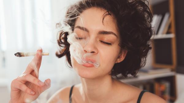 Woman smoking marijuana joint