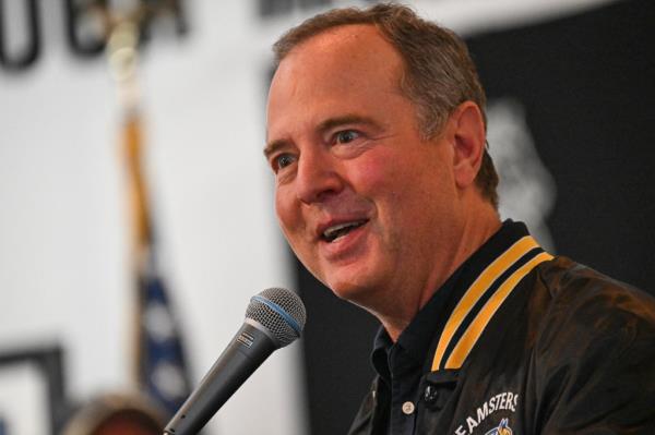 US Representative Adam Schiff speaking into a microphone at a rally in support of Amazon Teamsters Day of Solidarity