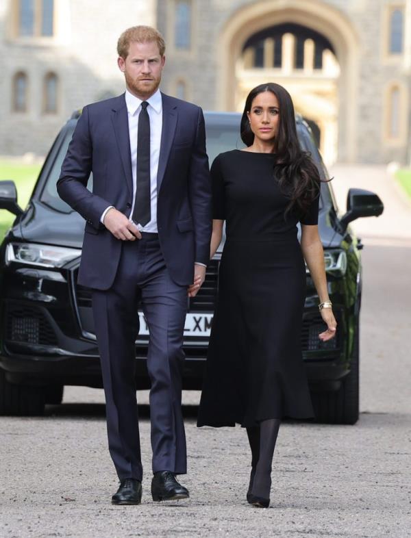 Prince Harry and Meghan, Duke and Duchess of Sussex, greeting crowds and viewing floral tributes to Queen Elizabeth at Windsor Castle