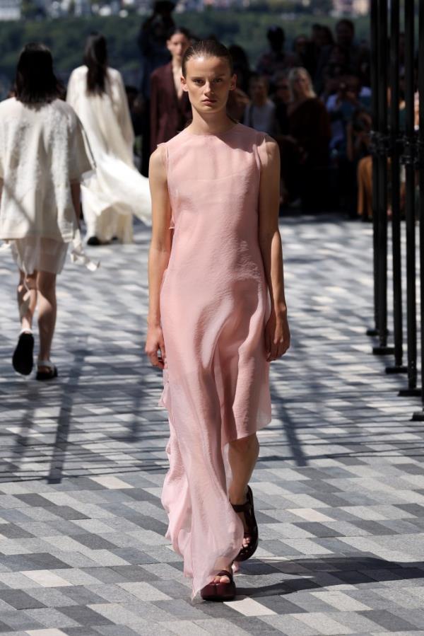 A model walking the runway at the Jason Wu Collection fashion show during New York Fashion Week in September 2024, wearing a pink dress.