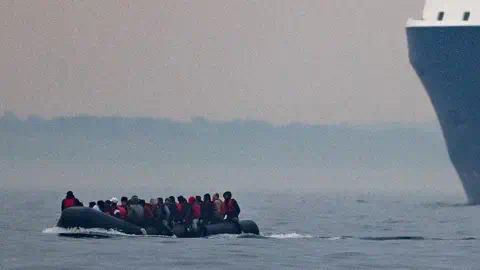 Getty Images People ride in a boat across the English Channel