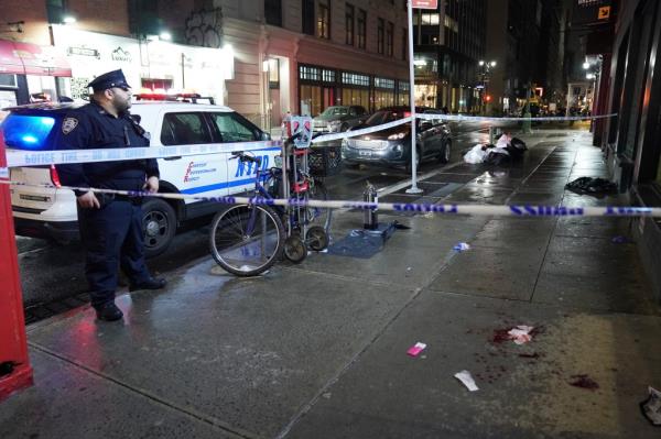 Police at the scene where a woman was assaulted on W31st Street at Sixth Avenue in New York, NY around 1:10 a.m. on March 18, 2023.