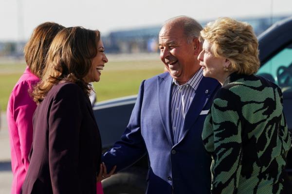 Vice President Harris getting greeted by Michigan Teamsters President Kevin Moore after arriving in Detroit on Sept. 19, 2024.