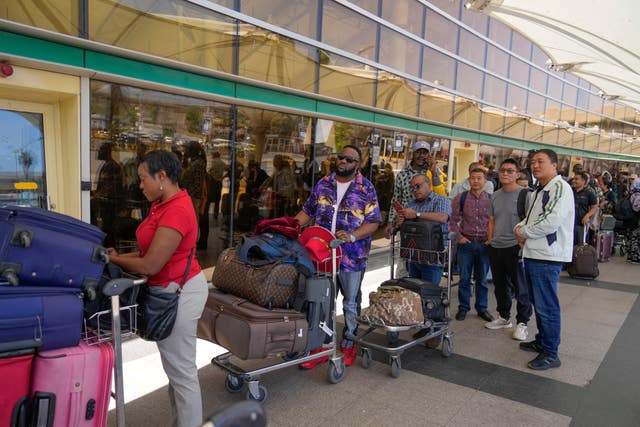 Stranded passengers wait for their delayed flights out of JKIA airport