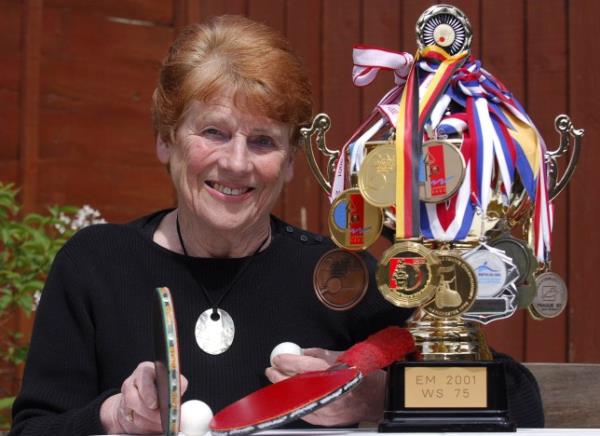 Edna Fletcher poses with her various accolades 