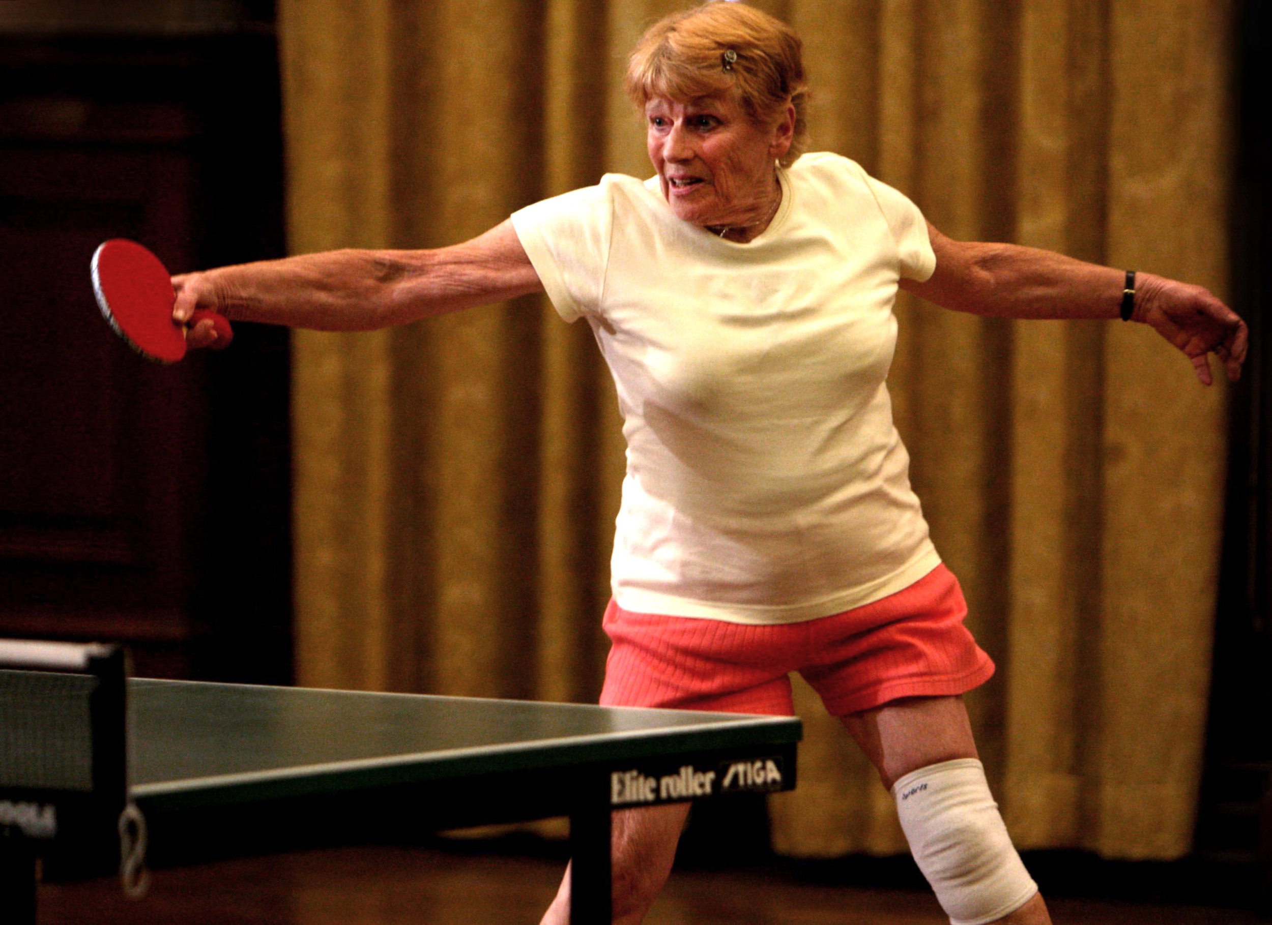 Edna Fletcher is seen playing a game of table tennis
