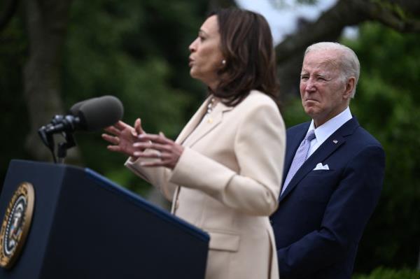 President Joe Biden looks on as US Vice President Kamala Harris delivers remarks during National Small Business Week in the Rose Garden of the White House in Washington, DC, on May 1, 2023
