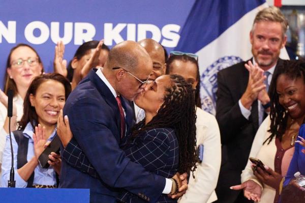New York City Schools Chancellor David Banks hugs his partner, First Deputy Mayor Sheena Wright.