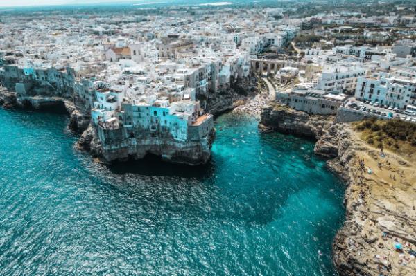 Mouthwash-blue water surrounding Polignano a Mare.