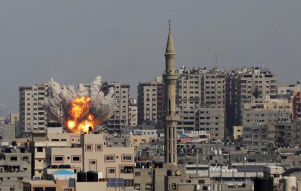 Smoke billows during Israeli air strikes in Gaza City on October 12, 2023