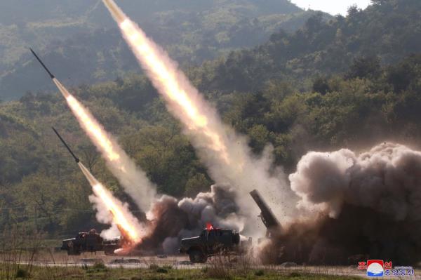 A photo released by the official North Korean Central News Agency (KCNA) shows missles being fired during a strike drill of military units at an undisclosed location in North Korea
