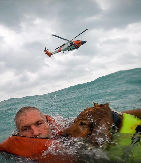 Earl Barcome and his 10-year-old Golden Retriever Gunn were rescued from their sailboat after the motor failed as Hurricane Helene barreled towards them in the Gulf of Mexico on Sept. 26, 2024.
