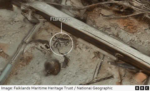 Falklands Maritime Heritage Trust / Natio<em></em>nal Geographic A flare gun lies among the wreckage. It is labelled to help it stand out.