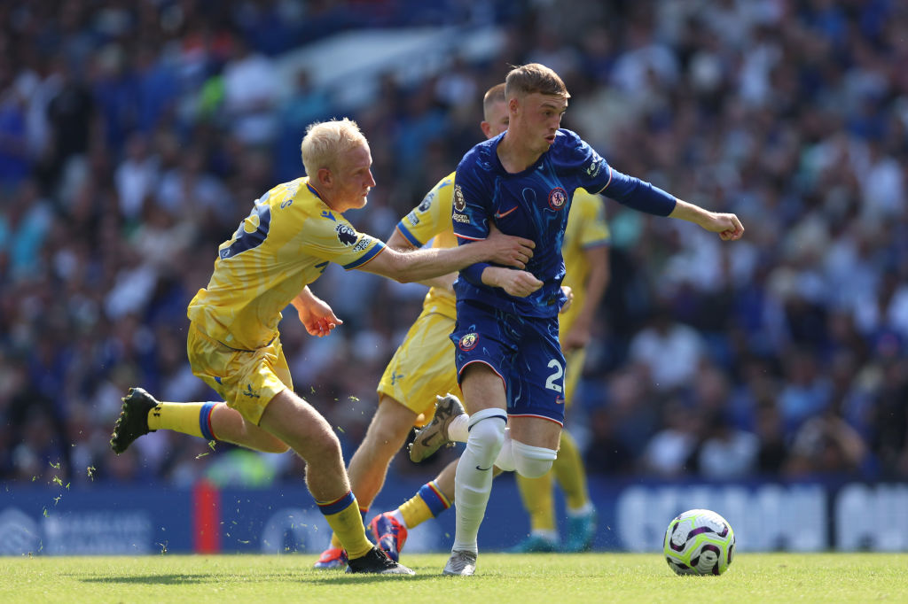 Cole Palmer of Chelsea is challenged by Will Hughes of Crystal Palace