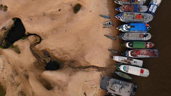 A drone view shows moored boats at the dry banks of Rio Amazonas during a drought in Santarem, Para state, Brazil.