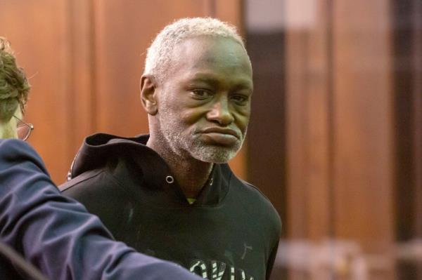 James Murphy, 58, is arraigned in Manhattan criminal court on Tuesday after dousing a police officer with rubbing alcohol and threatening to set him on fire at the 135th Street station in Manhattan.