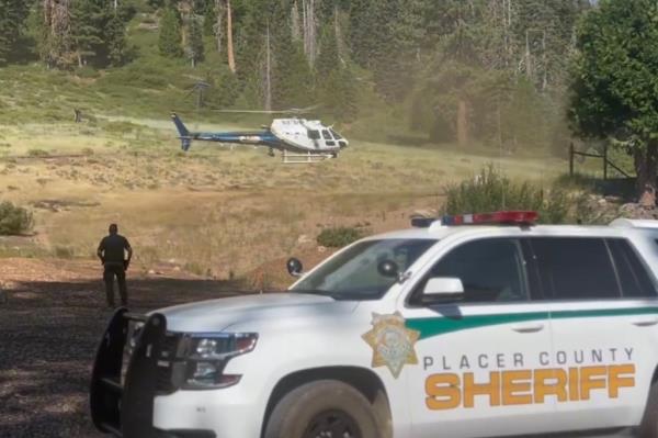 The helicopter brings Elliott to safety.