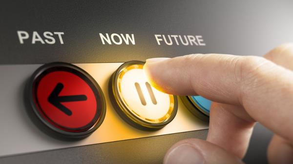 Person pushing time travel button
