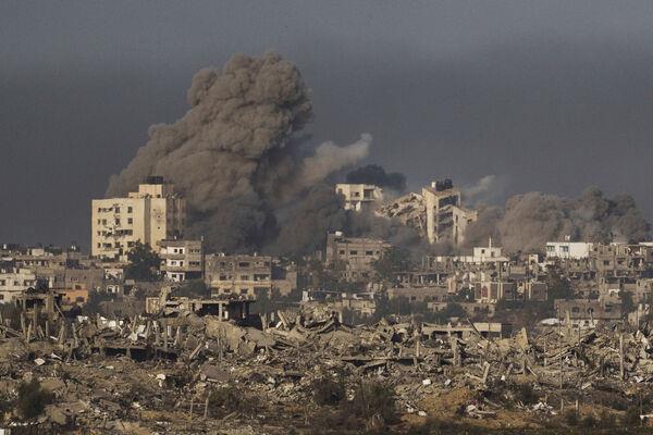 Smoke rises following an Israeli bombardment in the Gaza Strip, as seen from southern Israel. Picture: AP Photo/Leo Correa Smoke rises following an Israeli bombardment in the Gaza Strip, as seen from southern Israel. Picture: AP Photo/Leo Correa