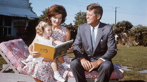 JFK and assistant checking documents
