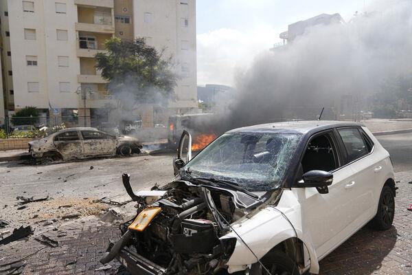 Cars are on fire after they were hit by rockets from the Gaza Strip in Ashkelon, Israel, on Saturday (Picture: AP /Tsafrir Abayov) Cars are on fire after they were hit by rockets from the Gaza Strip in Ashkelon, Israel, on Saturday (Picture: AP /Tsafrir Abayov)